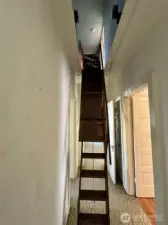 Pull-down stairs leading to sizeable attic