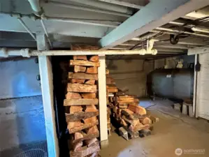 Stack of firewood in basement for fireplace