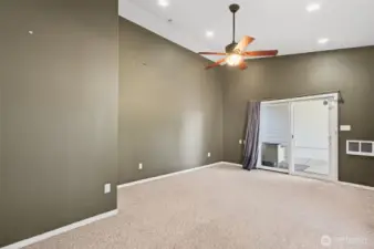 Family room with slider to back yard and garage.