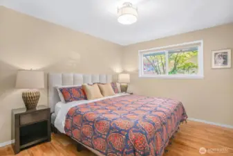 There are 3 bedrooms upstairs - this is the primary bedroom, and it fits a California king bed.