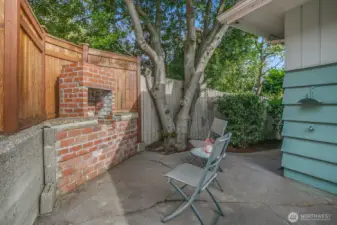 This is the cute backyard patio with a fireplace (it doesn't work but it adds some charm to this outdoor area).