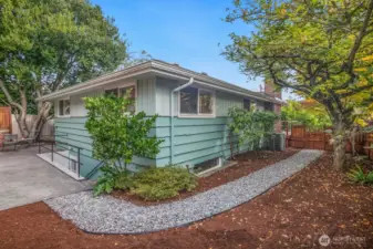 Here's a view of the back corner of the house showing the patio and the side yard.