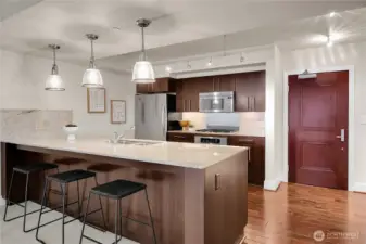 The kitchen dining bar is nice and long, and it is a good place to sit and visit.