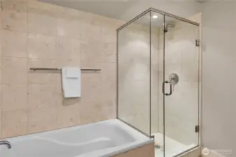 The full bath has a nice deep bathtub and a glass enclosed shower.