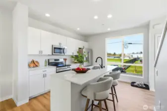 The over-sized window brings plenty of light into this space!