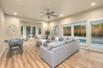 A spacious secondary living area with a well-appointed kitchenette