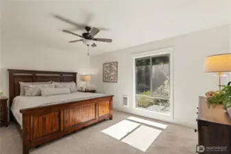 The over-sized primary suite offers a private bathroom and large walk-in closet