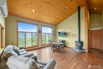 Large picture windows showcase sweeping mountain and valley views.  Ductless mini-split system offers quiet and efficient heating/cooling.