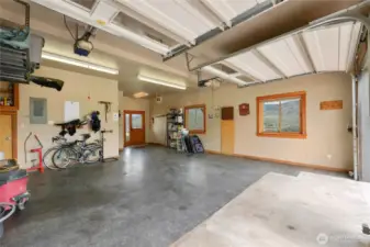 Two garage doors, extra storage rack, utility room and laundry room. Quality enough to convert to living area.