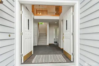 Entrance, Vaulted Ceiling Foyer with access to Living, Family, Dining, Office, and Stairs to Upper Floor.