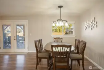 Spacious dining room, with French doors leading out to the back patio