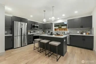 Luxury kitchen with custom cabinets, Quartz counters and luxury SS appliances.