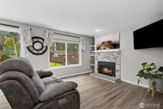 Spacious living room with beautiful stack stone gas fireplace