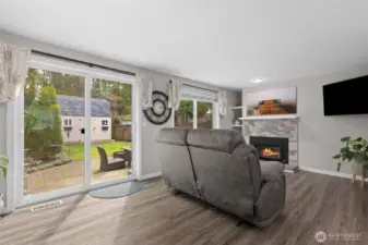 Living room area looking out to fully fenced backyard