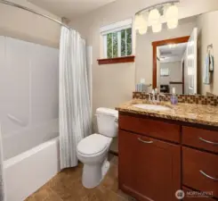 Stylish finishes were not forgotten in upstairs full bathroom.