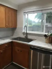 Oversized sunken sink, wood cabinetry, recessed lighting just to name a few of this home's appeal.