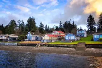 View from the water. House is the one with the red metal roof!