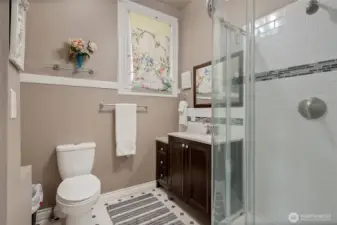 This is the Bathroom with Tiled shower for Unit B.