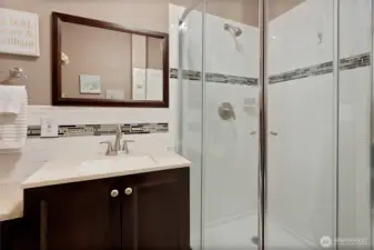 Another view of the vanity and Tiled shower in Unit B.
