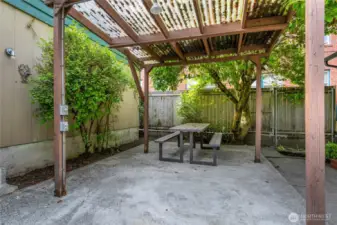 Outside is a covered patio that is shared by all Units.