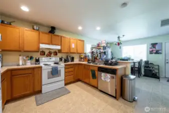 Kitchen offers addition space for dining.