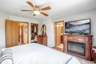 Primary bedroom with walk in closet with custom built closet system