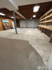 Additional 4 car garage with additional storage rooms and workbenches.