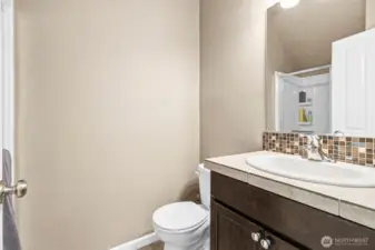 .75 bath on the main floor, shower behind the door.
