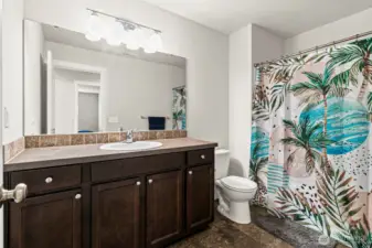 Full bath in the middle of the hall for the bedrooms and bonus room.