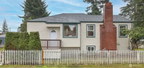 Perfectly situated on a corner lot with a brand-new 30-year roof.