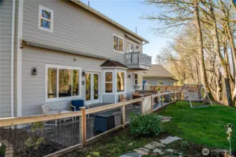 Fenced patio area with huge retractable awning.