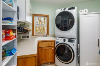Laundry room has lots of storage space and a great view of the river.