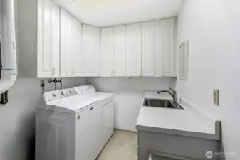 Laundry room with utility sink on the lower level
