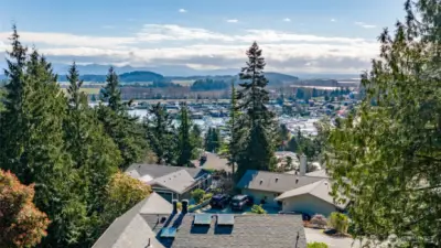A birds-eye view of Shelter Bay and Skagit Valley reaches across the channel, through the farmlands, and rises to the peaks of this recreational wonderland. Come visit in early morning at dusk or moon-rise and see the magic!