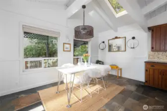 Invite nature in for dinner! Upgraded, energy efficient vinyl windows, wainscotting, on-trend light fixtures and skylights are just a few of the many upgrades found throughout this thoughtfully improved home.