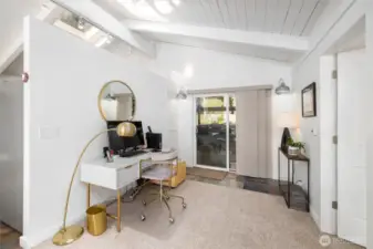 Flexible bonus space off the carport—perfect for a home office, studio, or formal dining area. Slate tile flooring and plush wall-to-wall carpet too.