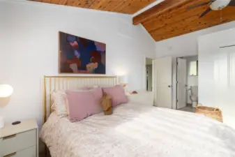 Located just off the flex space/foyer area of the great room, you’ll find the main-level ensuite, offering quiet repose, a ceiling fan for comfort, and a ¾ primary bath. Easy access for daily living.