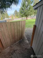 Side gate for easy access from front to backyards on left side of home