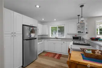 Kitchen with new appliances, new lighting, and undermount lights.