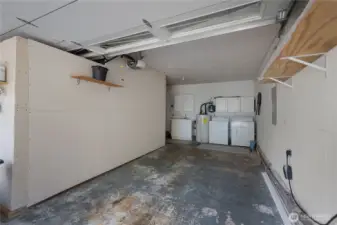 EV Car Charger in garage - 2 car garage with a room built-in for added storage.