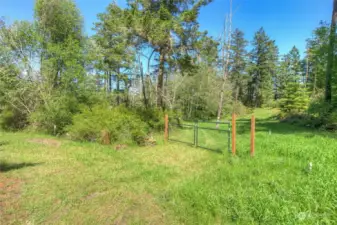 Gate entrance enters into access easement for lot and community well.