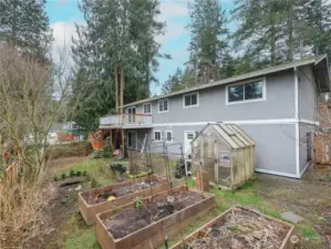 FENCED BATH YARD WITH RAISED BEDS, GREENHOUSE, DECK WITH YARD ACCESS & PATIO TO LOWER LEVEL