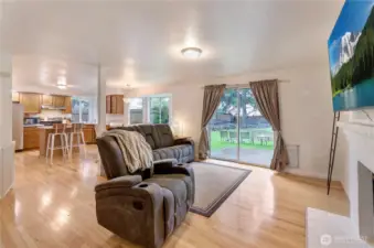 Family room off kitchen with fireplace and wall mounted tv stays!