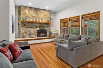 Cozy living room with wood burning fireplace.