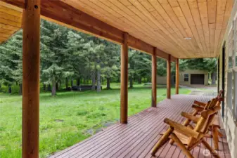 Enjoy peaceful woodland views and rustic charm from the inviting wrap-around porch.
