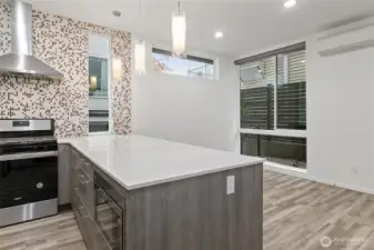 Modern, natural light, high ceilings, floor to ceiling windows, efficient mini-split heating and cooling, and on-demand tankless water heater for modern comfort.