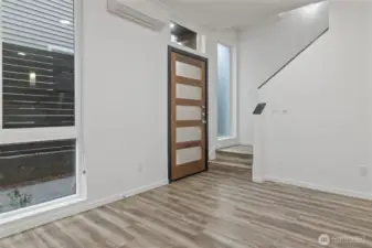 The high ceilings, and natural light from floor to ceiling windows enhance the living areas.