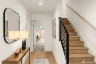 Bright and airy staircase featuring light wood tones