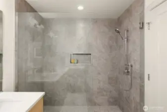 Spacious primary bedroom featuring high ceilings and large windows for a peaceful retreat