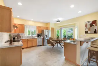 Any chef would be happy to cook in this amazing kitchen!  Lots of counter space and storage.  Wolf Gas range/oven, new refrigerator, stainless appliances, maple cabinets and trendstone countertops.